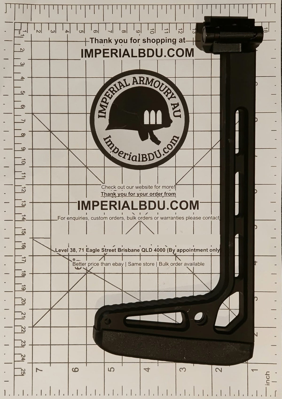 A black MCX MPX folding stock adjustable rifle stock buttstock with a sling attachment, displayed on a white grid measurement mat with Imperial BDU branding.